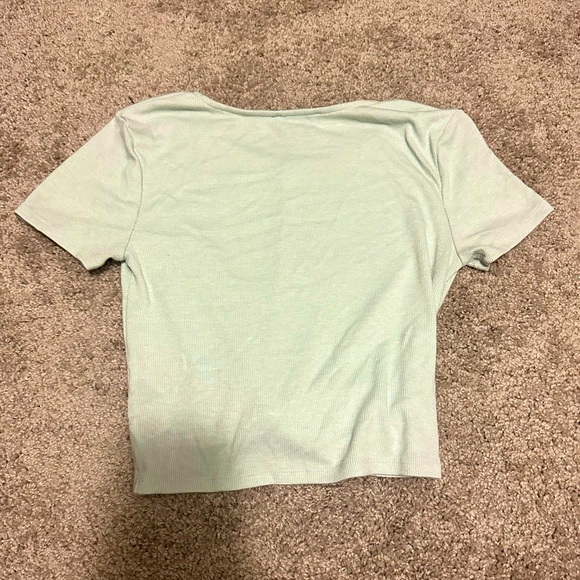 Small, mint green crop top with a scrunched knot in the front. - Picture 2 of 2